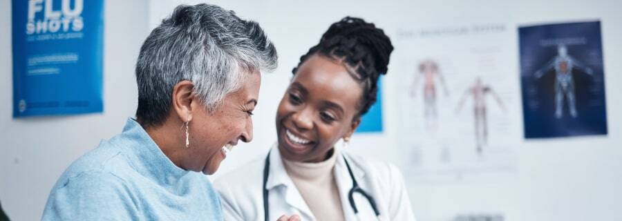 Happy patient talking to doctor