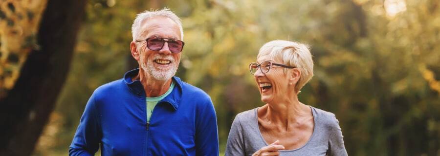 Elderly couple walking in the park